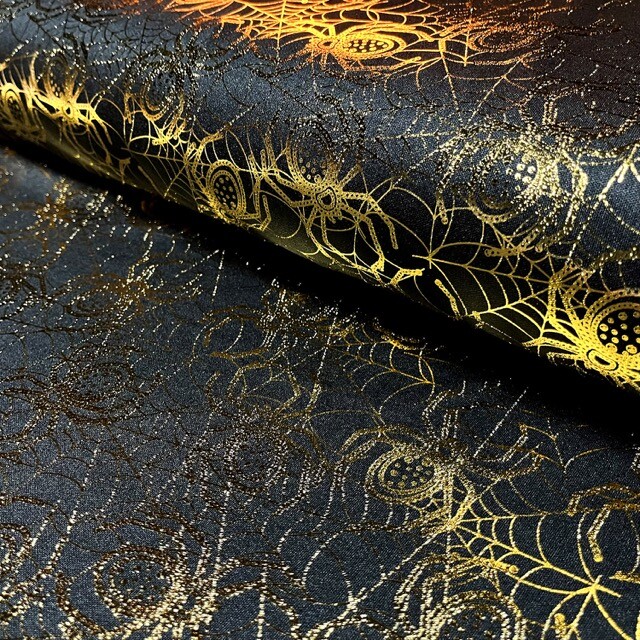 Polyester jersey spinnen folie zwart/goud
