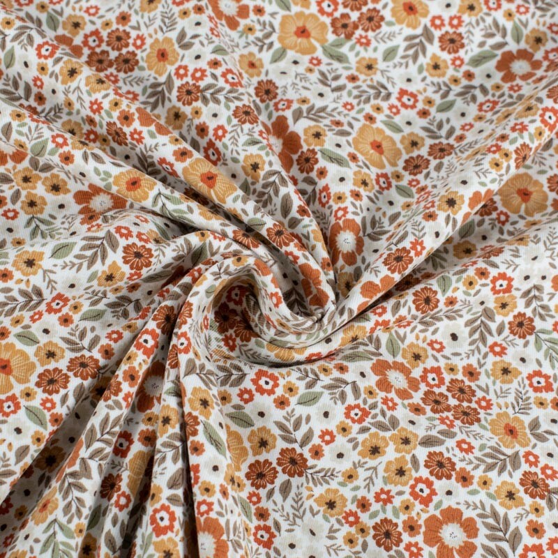 Katoen tricot bloemen offwhite