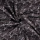 Poly viscose jersey stof discharge bedrukt dieren zwart