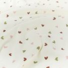 Stretch badstof bedrukt hartjes offwhite